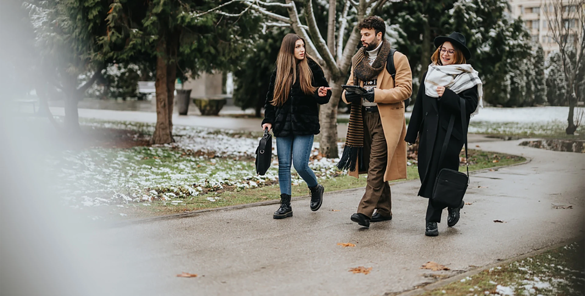 Friends walking outdoors in winter to support immune health, circulation, and seasonal resilience as part of a proactive wellness routine.