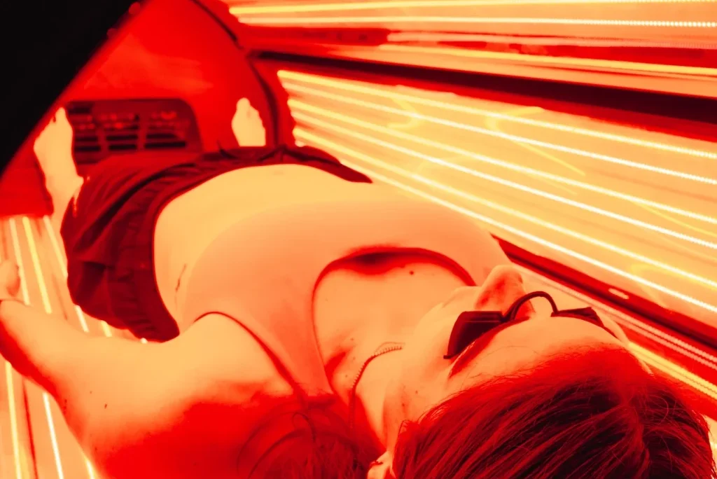Customer experiencing advanced red light therapy for mitochondrial support at Re:nu London