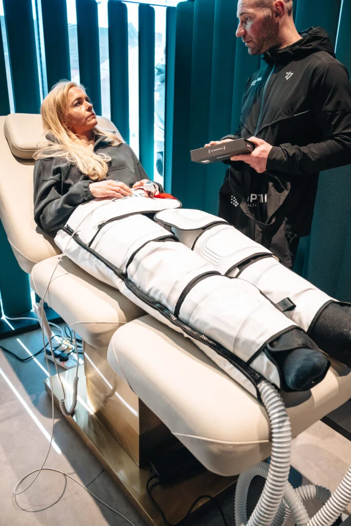 Re:nu customer using compression therapy and lymphatic drainage to support physical recovery, longevity, and mental well-being.
