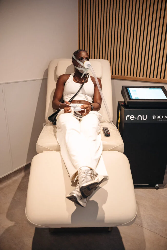 Customer using hypoxic therapy to support healing and recovery at Re:nu Optimum Health in Greenwich, London