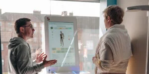 Re:nu wellness consultant discussing health assessment results and treatment options with a client