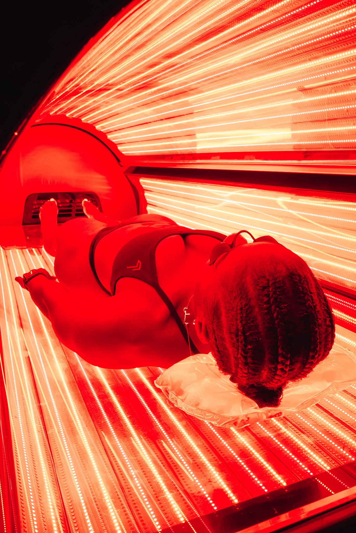 Full-body red light therapy session at Re:nu London for stress relief and mood regulation.